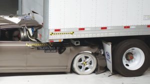 Truck_Crash_tests_by_IIHS_show_car_crushed_underneath_truck_without_underride_guard