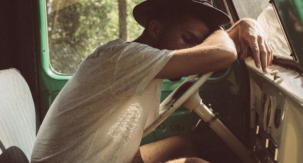 Sleeping-behind-wheel-of-truck